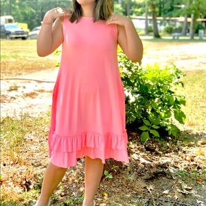 Bright pink ruffle dress.